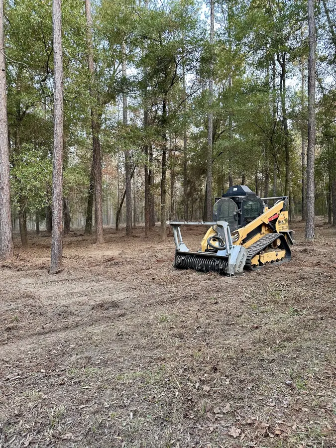 Mulching equipment in a wooded lot